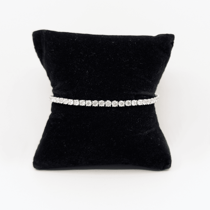 A 3mm sterling silver bracelet with brilliant cut moissanite.