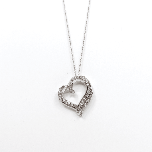 A 10k white gold necklace with a 1ctw natural diamond heart pendant design. Length: 18"