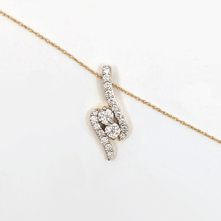 A 14k yellow gold necklace with a 0.76ctw natural diamond pendant design. Length: 18"