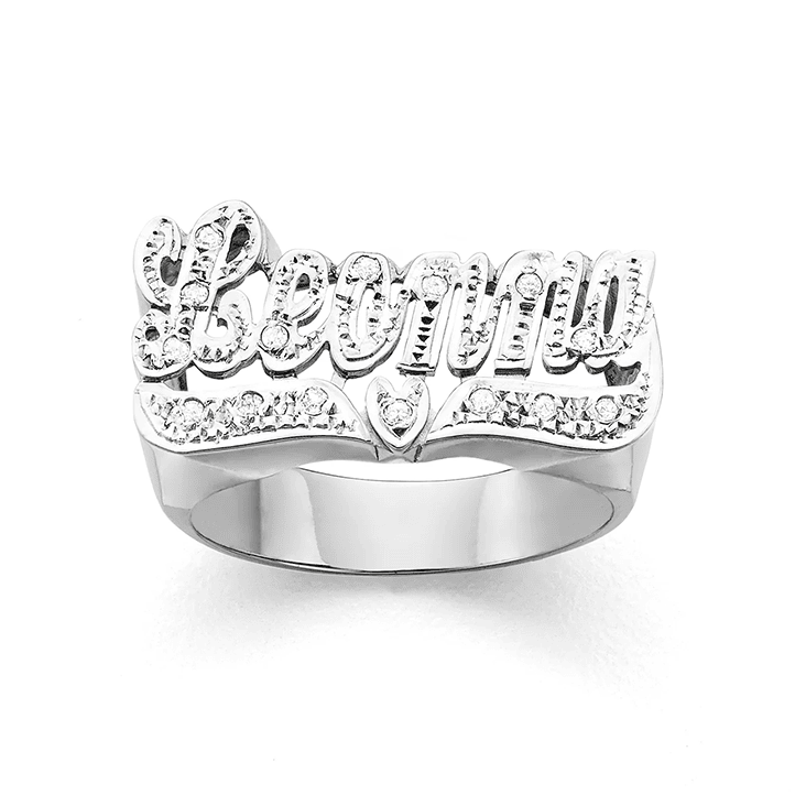 Personalized script letter white pave cut on top and heart tail name ring.