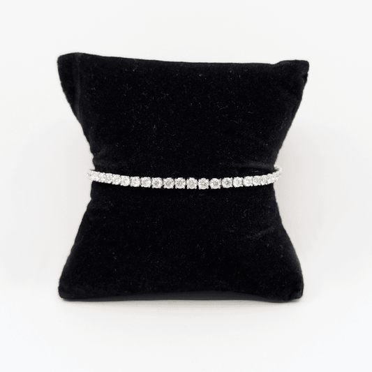 A 3mm sterling silver bracelet with brilliant cut moissanite.