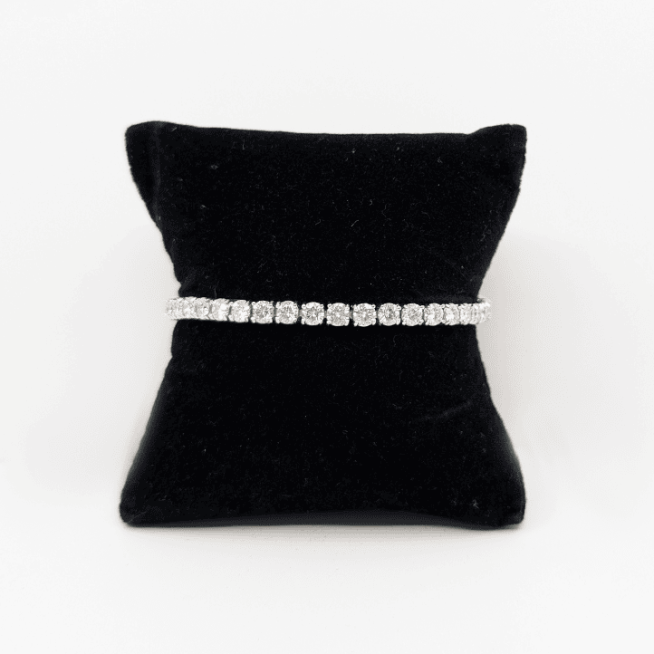 A 4mm sterling silver bracelet with brilliant cut moissanite.