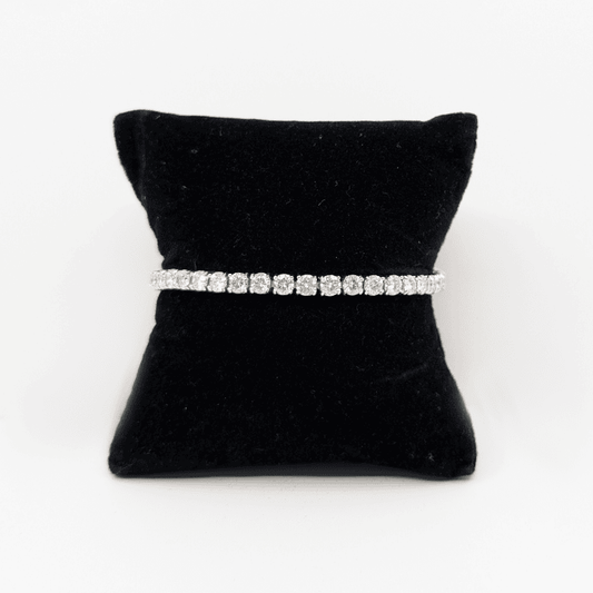 A 4mm sterling silver bracelet with brilliant cut moissanite.