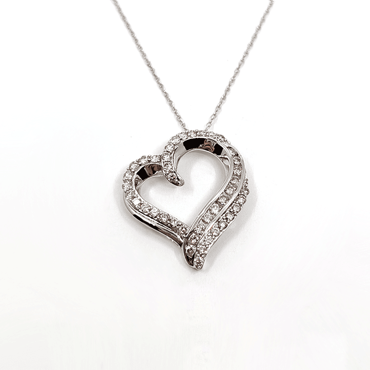 A 10k white gold necklace with a 1ctw natural diamond heart pendant design. 