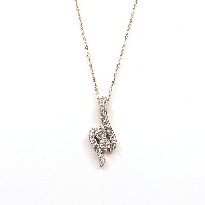 A 14k yellow gold necklace with a 0.76ctw natural diamond pendant design. 