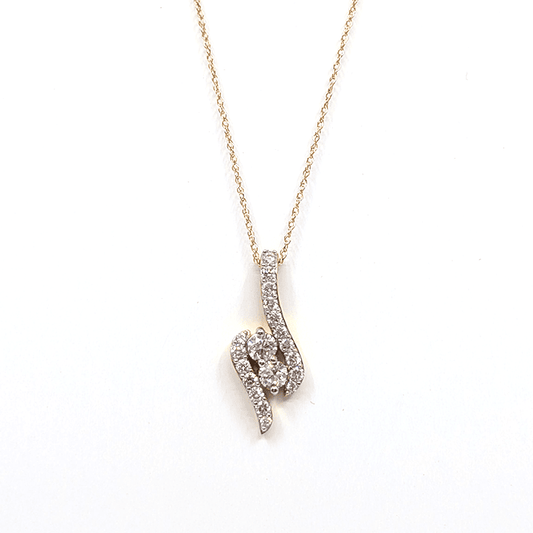 A 14k yellow gold necklace with a 0.76ctw natural diamond pendant design. 